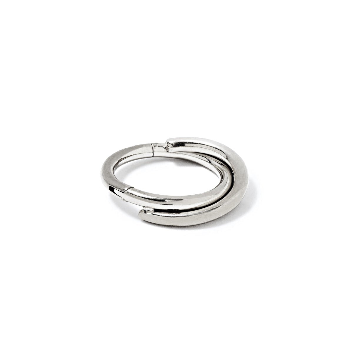 Silver titanium criss-cross cartilage hoop, close-up on a white background