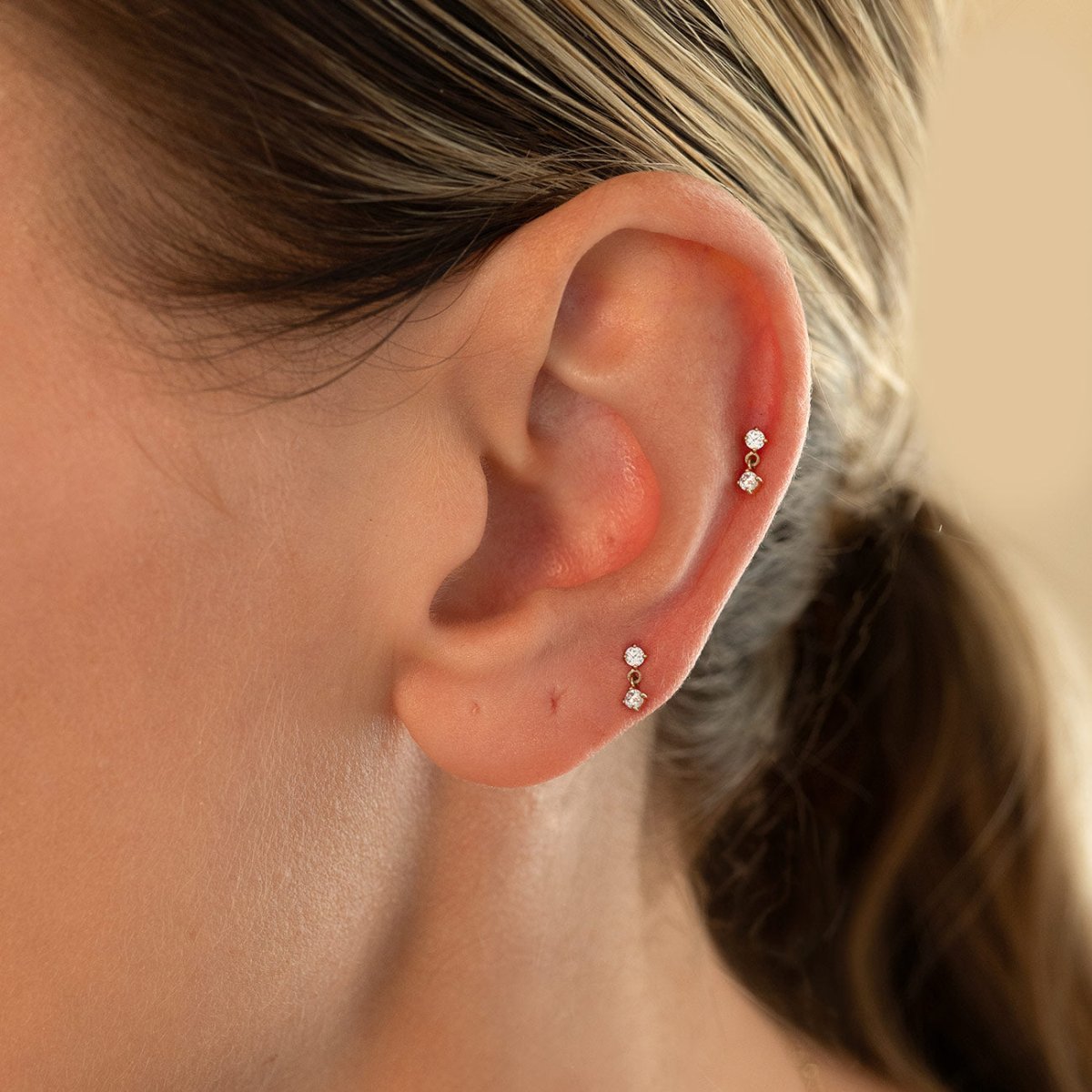 14K gold gemstone dangle flat back stud earrings, shown on a model