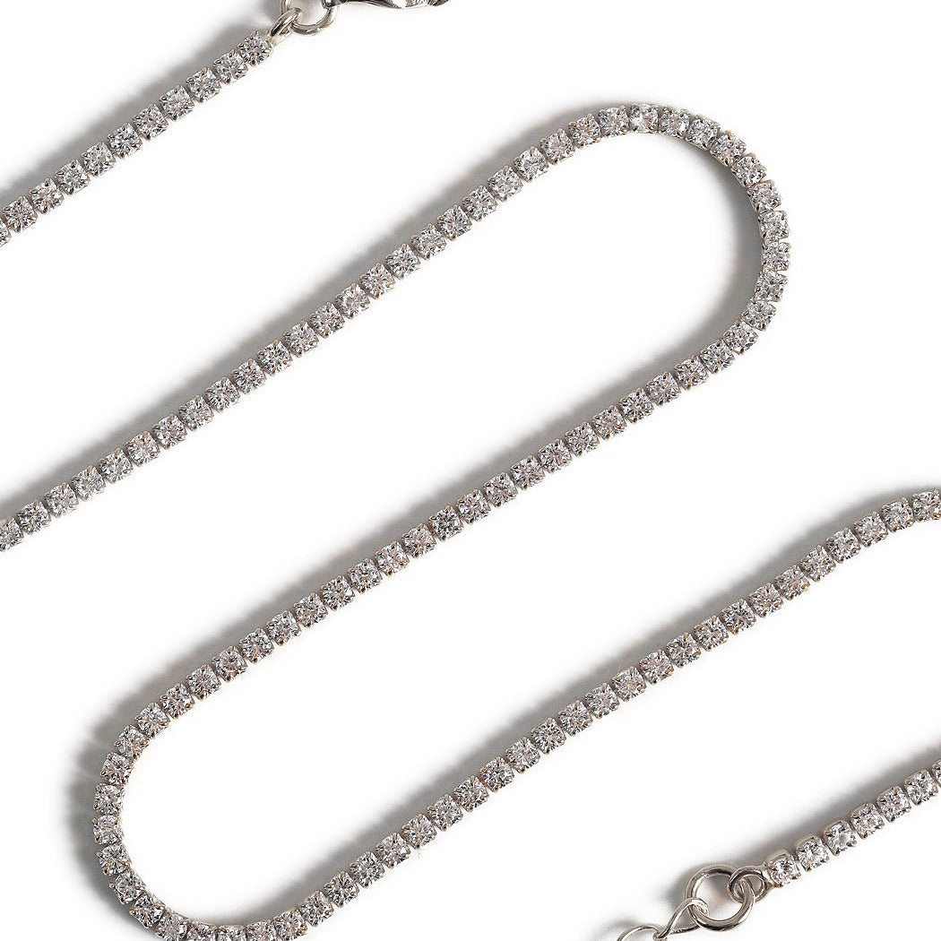 Sterling silver crystal choker, close-up detail of the round clear stones in a row, on a white background