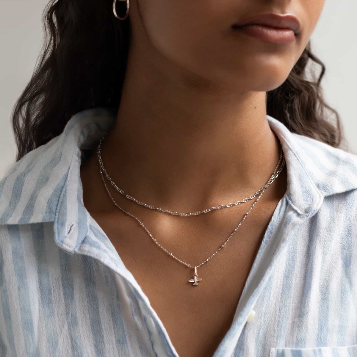 Sterling silver beaded chain choker shown on a model's neckline with a second pendant chain