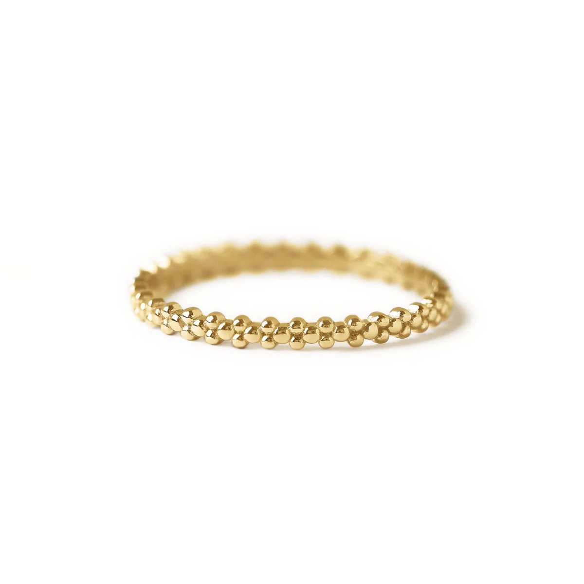 Gold vermeil eternity bead ring with a beaded band, on a white background