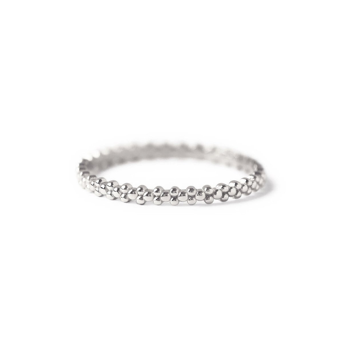 Sterling silver eternity bead ring with a beaded band, on a white background