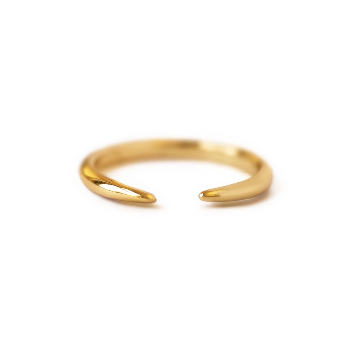 Gold vermeil open claw ring with tapered claw ends, on a white background