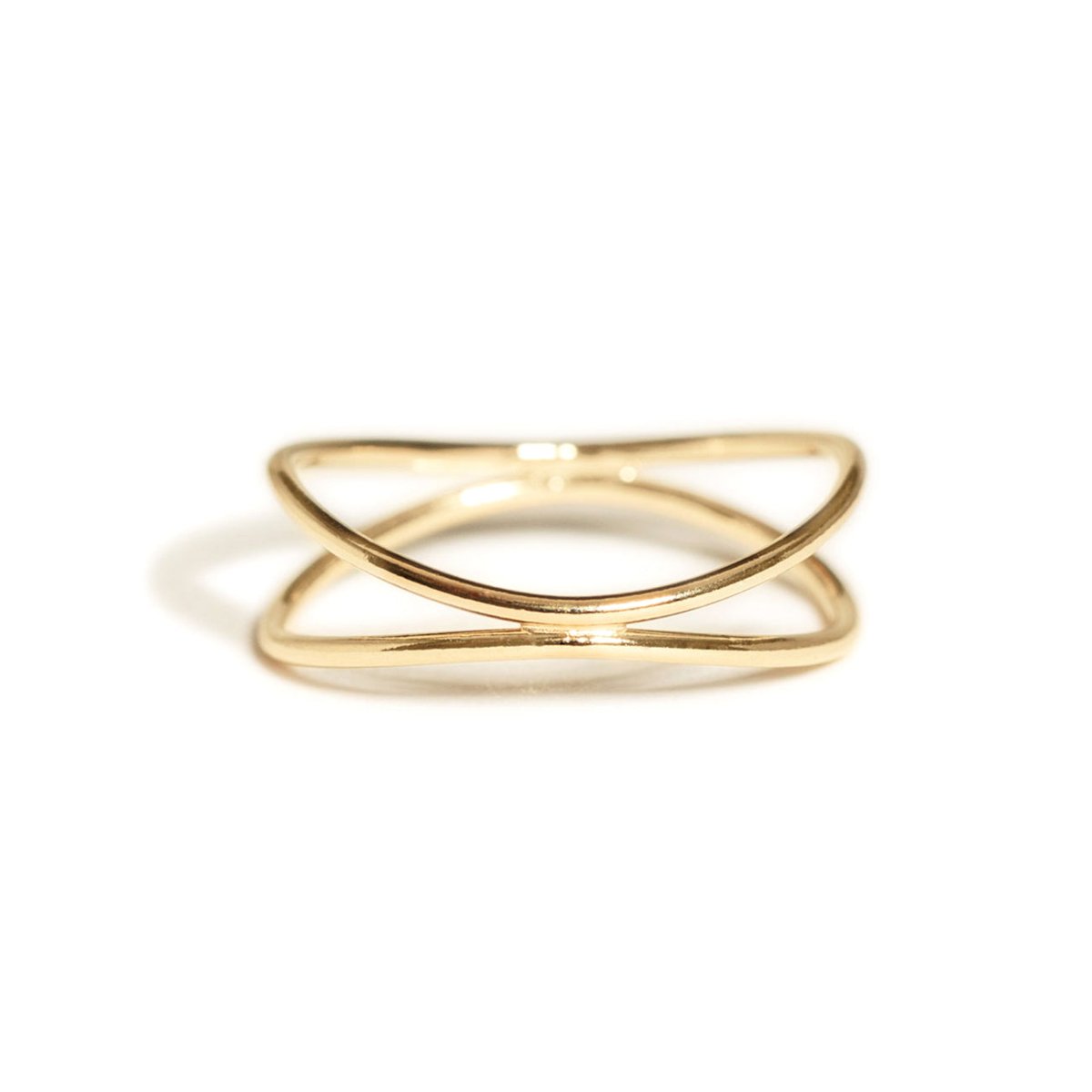 Gold-filled criss-cross ring with two crossing bands, on a white background