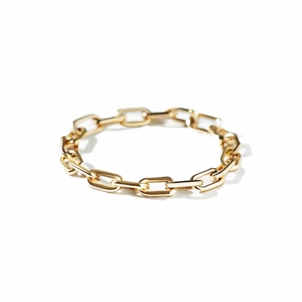 Gold-filled paperclip chain ring with elongated open links, on a white background