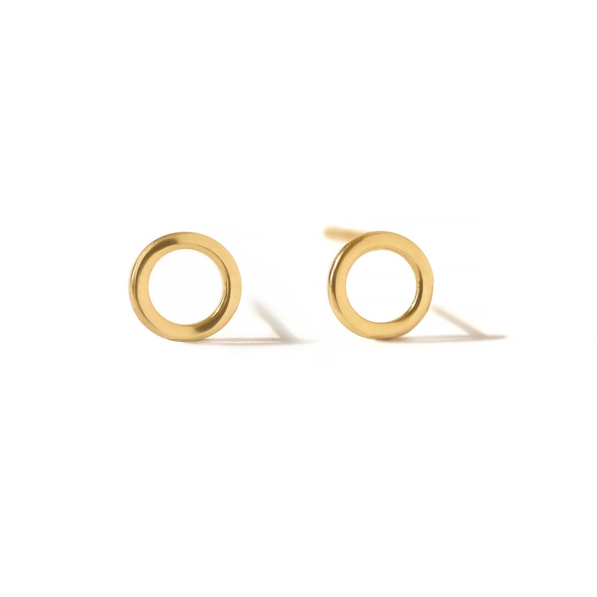 Pair of 14K gold open circle stud earrings on a white background
