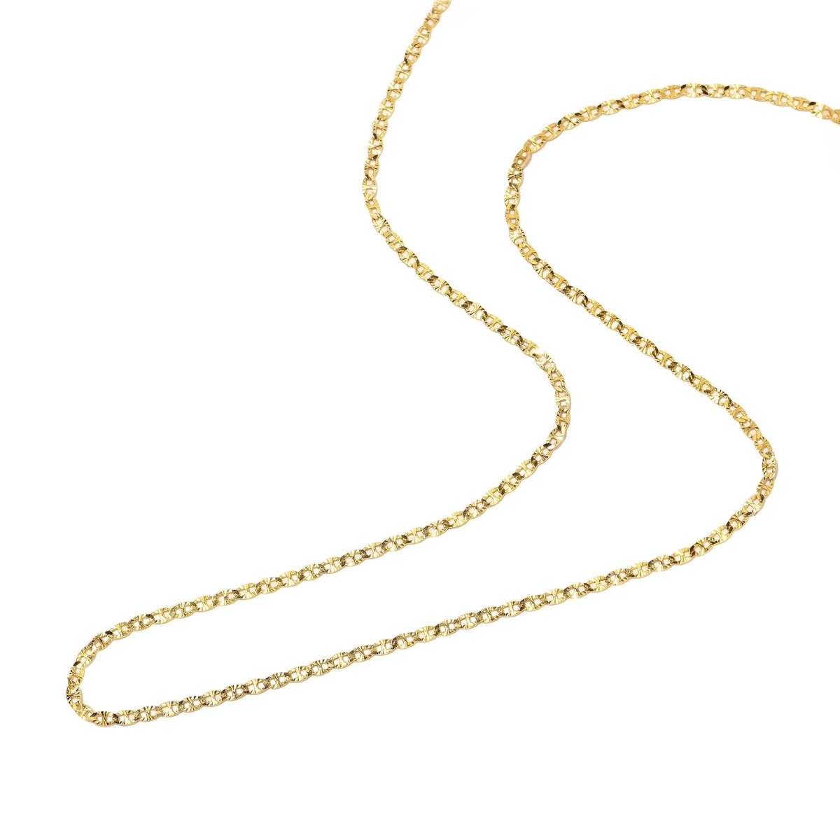 Gold vermeil diamond-cut mariner anchor link chain laid in an S-curve on a white background