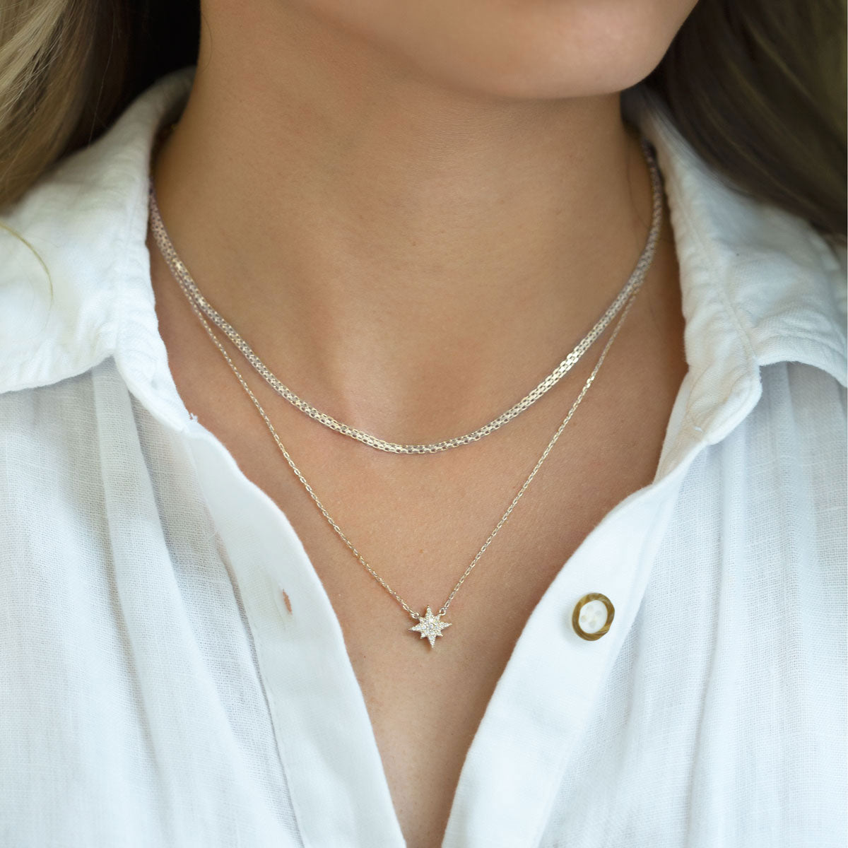 Sterling silver Bismark chain choker layered over a finer chain, shown on a model's neckline