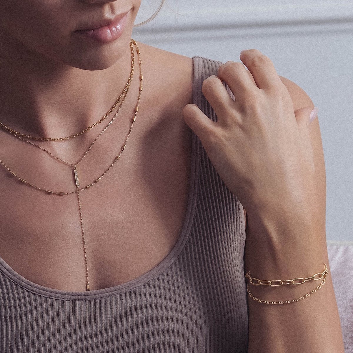 Gold vermeil chunky link chain bracelet, close-up detail on a model's wrist