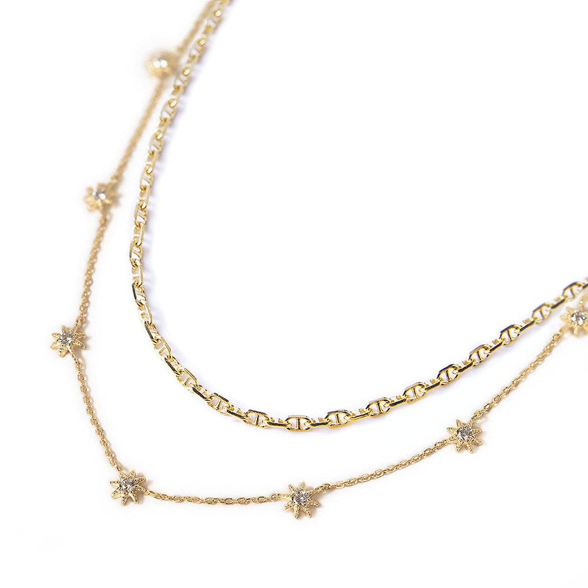 Gold vermeil layered duo with a Marina chain and white zirconia starburst station chain, on a white background