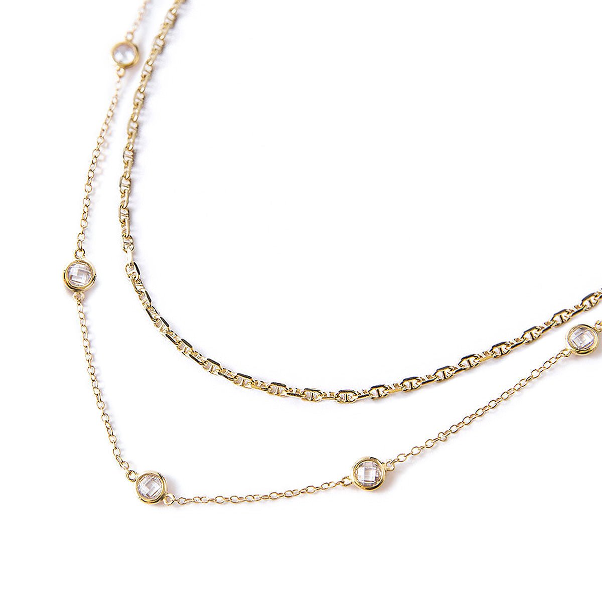 Gold vermeil Marina chain and clear crystal station chain layered duo, on a white background