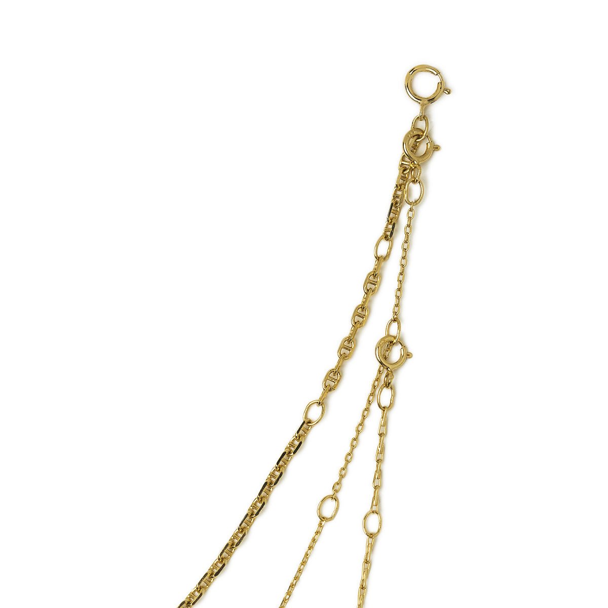 Gold vermeil Marina disc layered trio, close-up of the spring-ring clasps and chain links on a white background