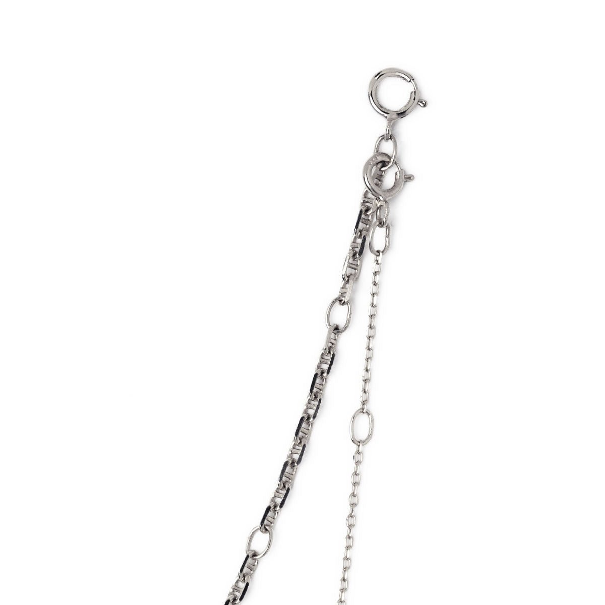 Sterling silver layered necklace duo with mirror and cable chains and a spring-ring clasp, close-up detail
