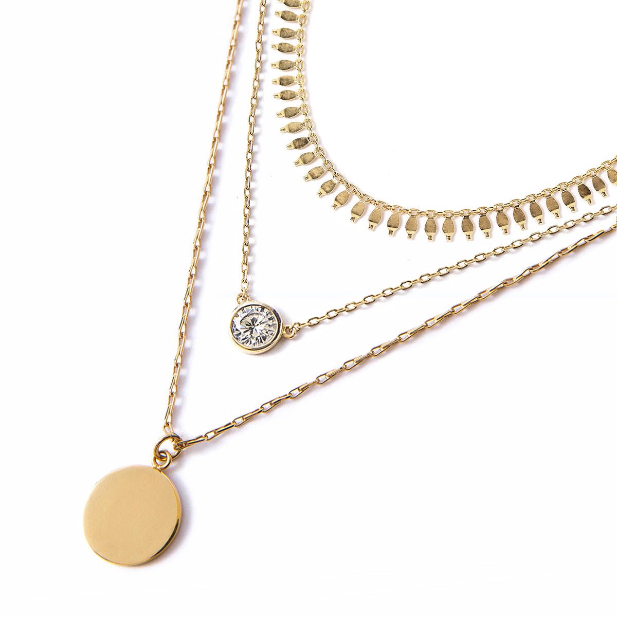 Gold vermeil fringe choker with a bezel-set clear stone and disc coin layers, on a white background
