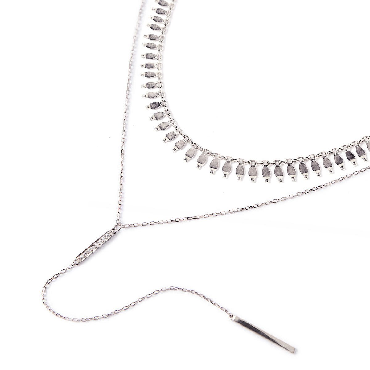 Sterling silver fringe choker layered with a pave clear-stone lariat bar, on a white background
