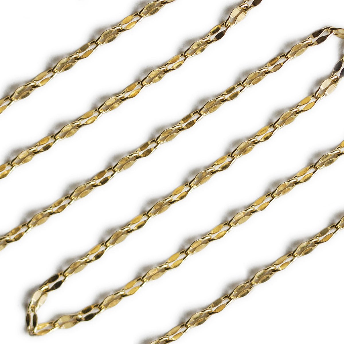 Gold vermeil chain choker, close-up detail of the flat mirrored links on a white background
