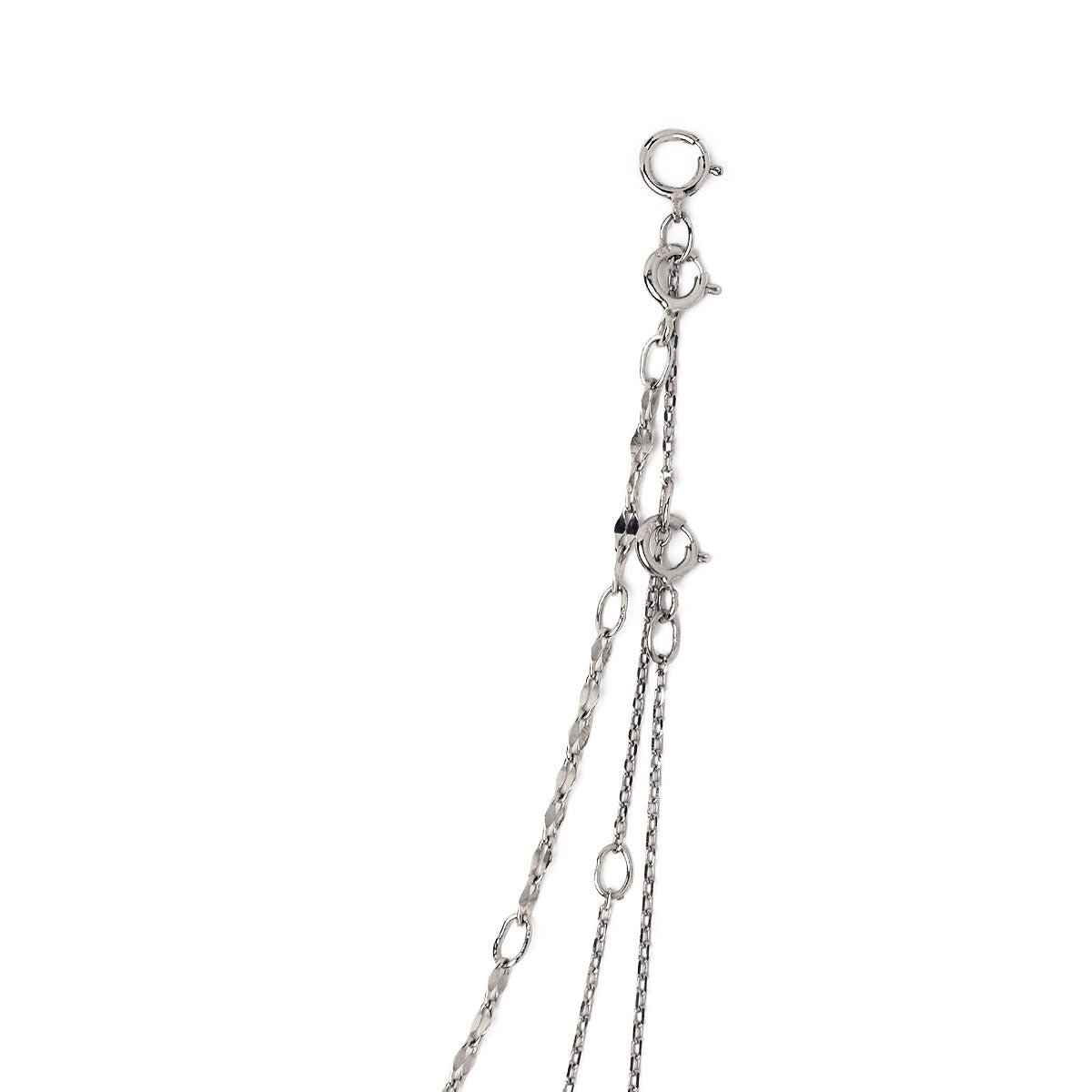 Sterling silver layered necklaces, close-up detail of the flat links and spring-ring clasps on a white background