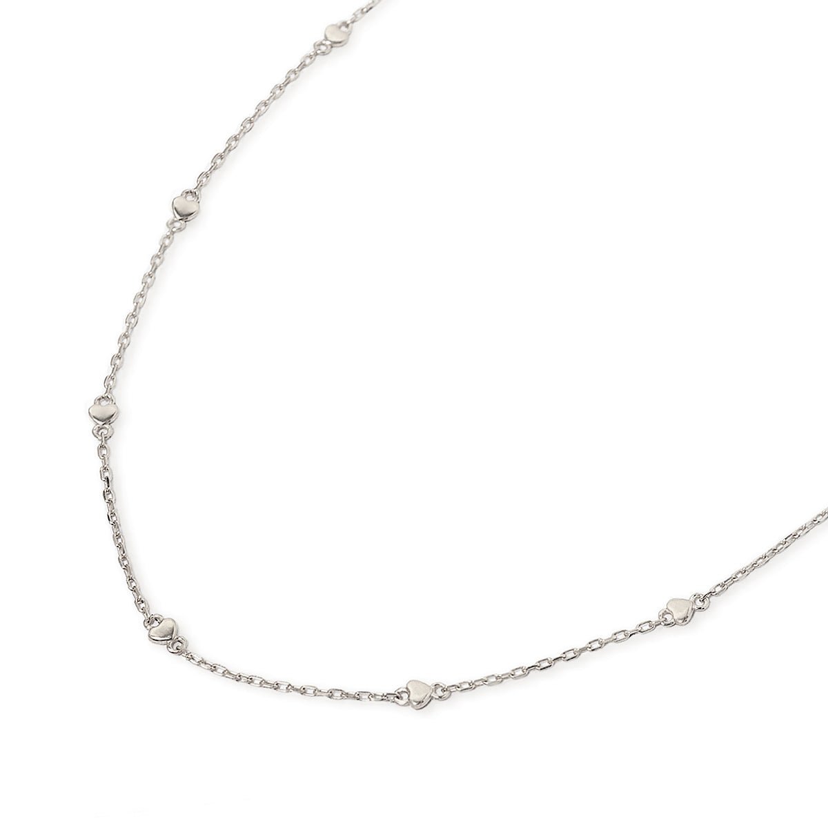 Sterling silver heart-station chain necklace with small flat hearts, laid on a white background