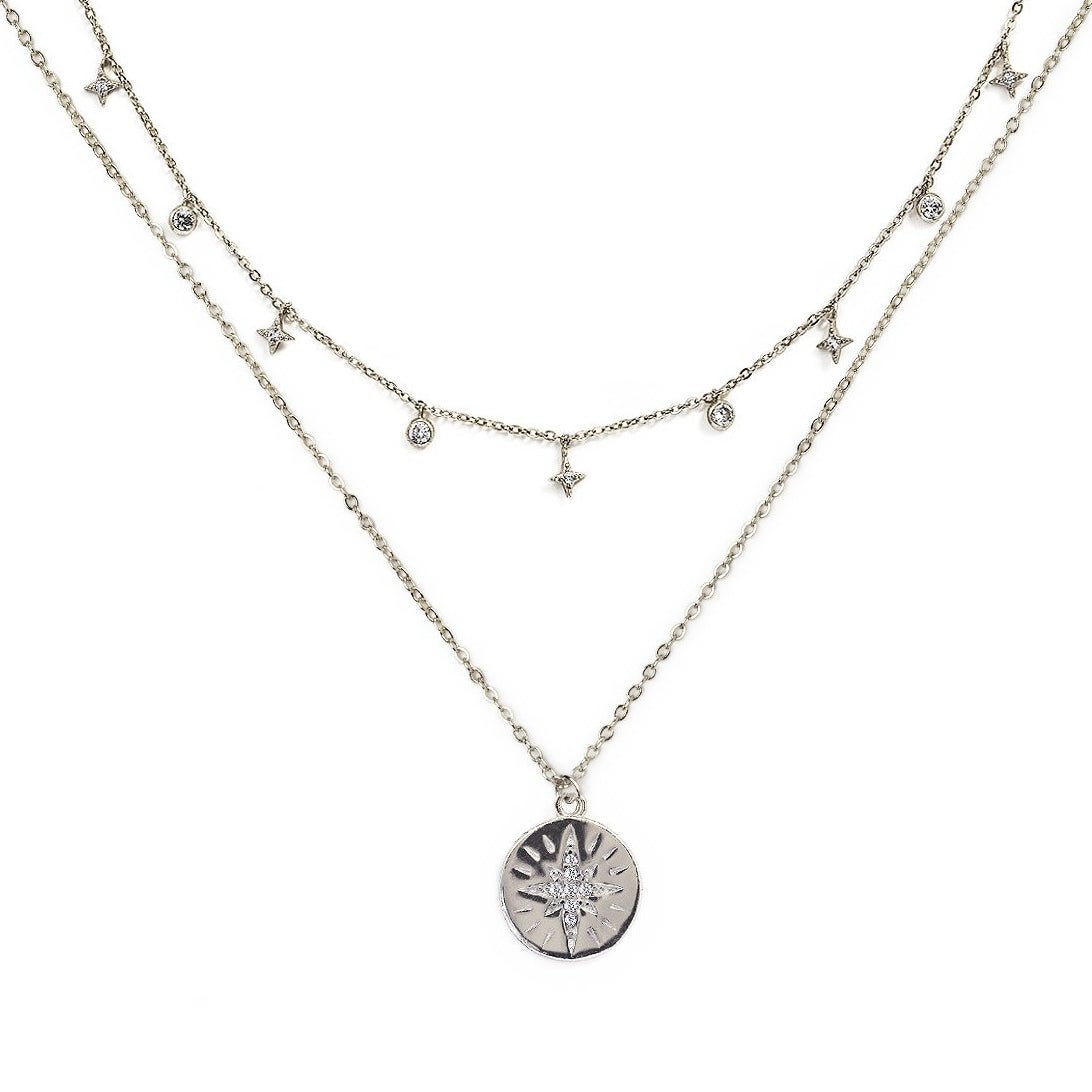 Sterling silver layered duo with a clear-stone starburst disc and a star and stone station chain, on a white background