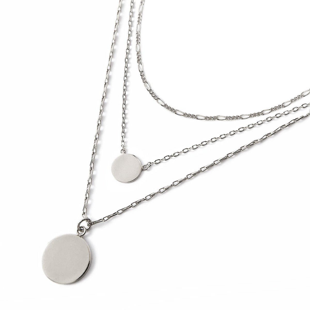 Sterling silver Figaro disc trio necklace with three graduated discs and chains, on a white background