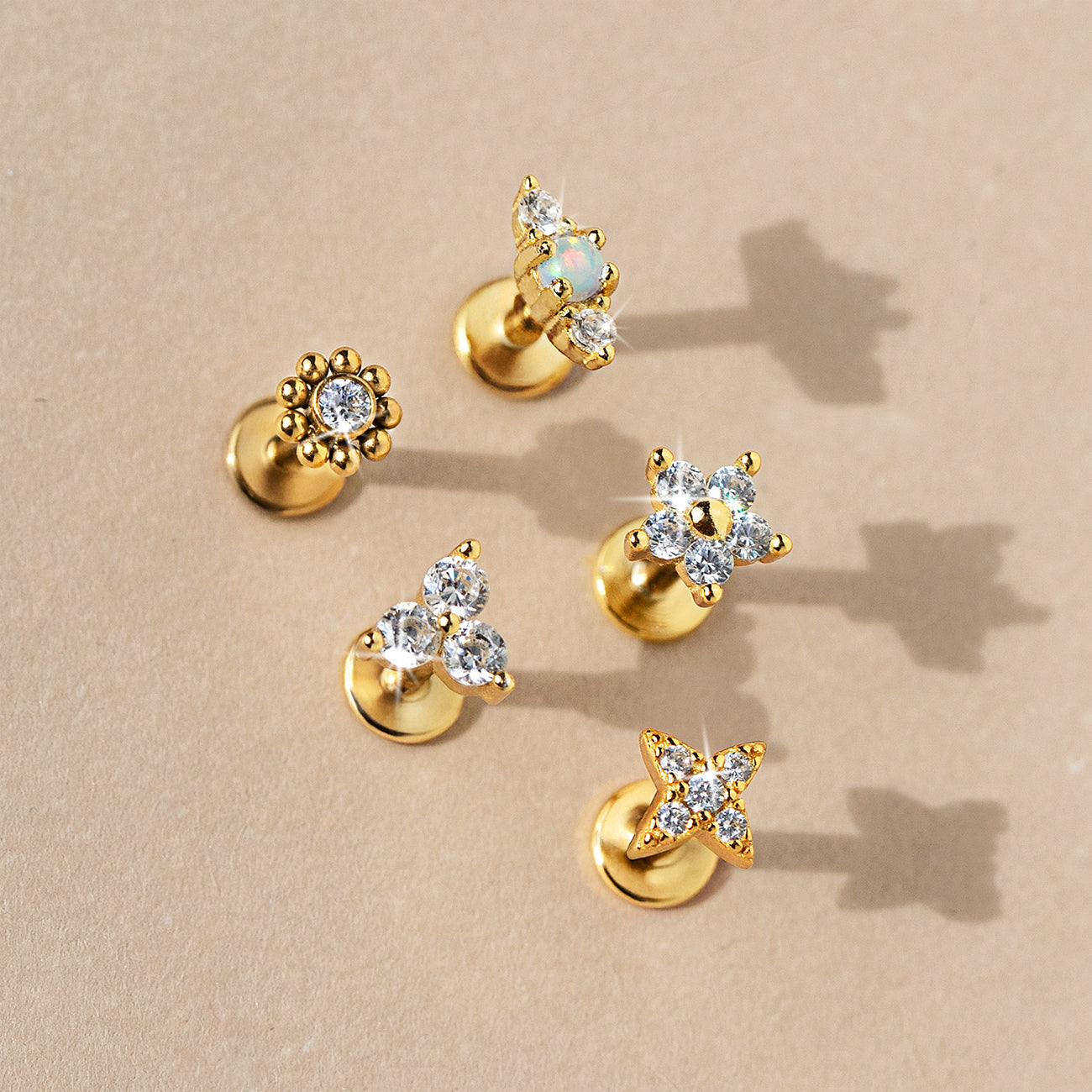 Gold Flat Back Stud Earrings featuring crystal designs and opal gemstones from AMYO