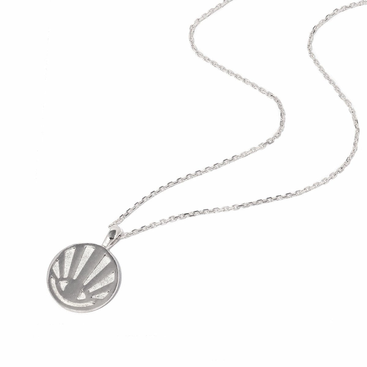 Sterling silver round sunburst rays pendant necklace on a chain, on a white background