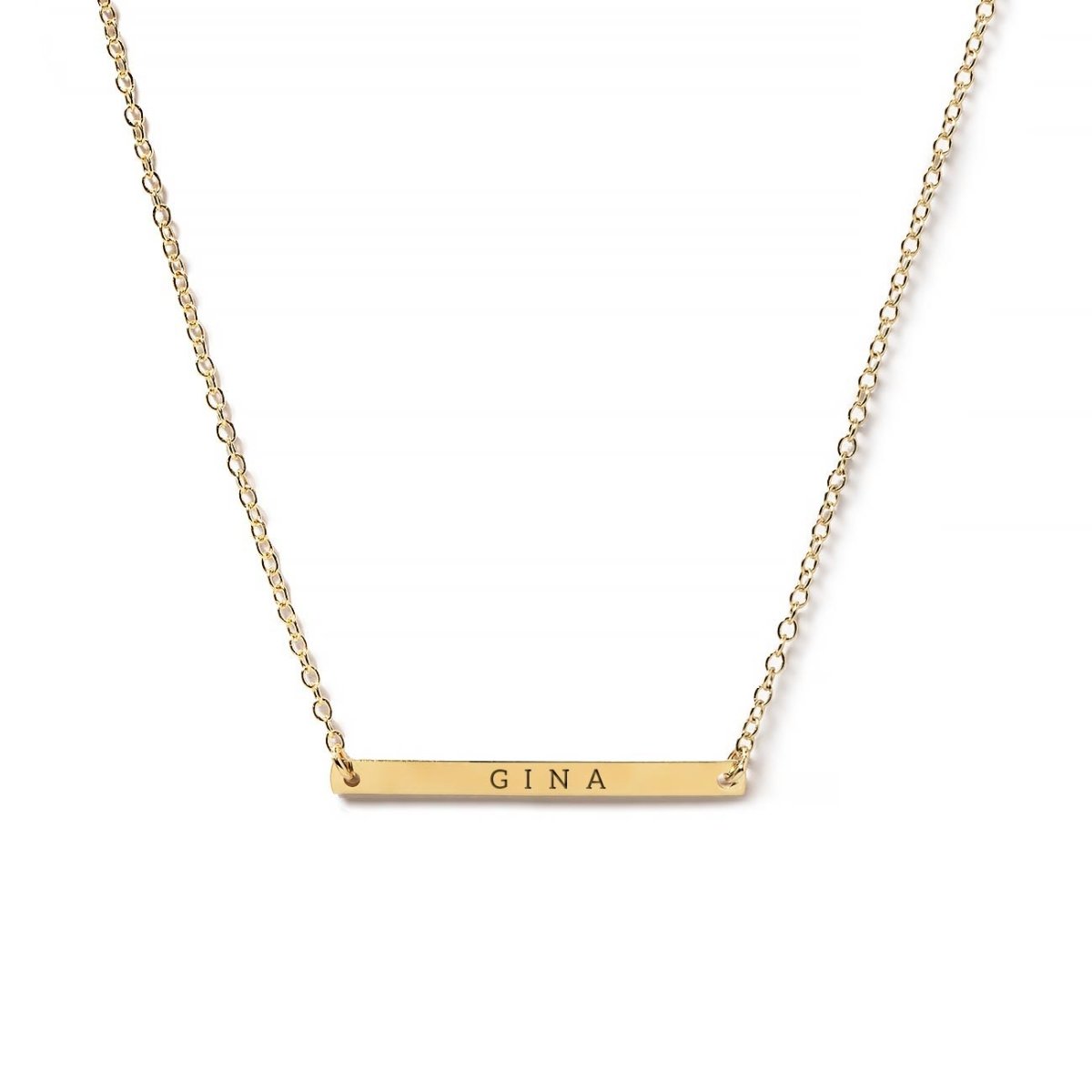Gold-filled thin bar necklace engraved with a name on a delicate chain, on a white background
