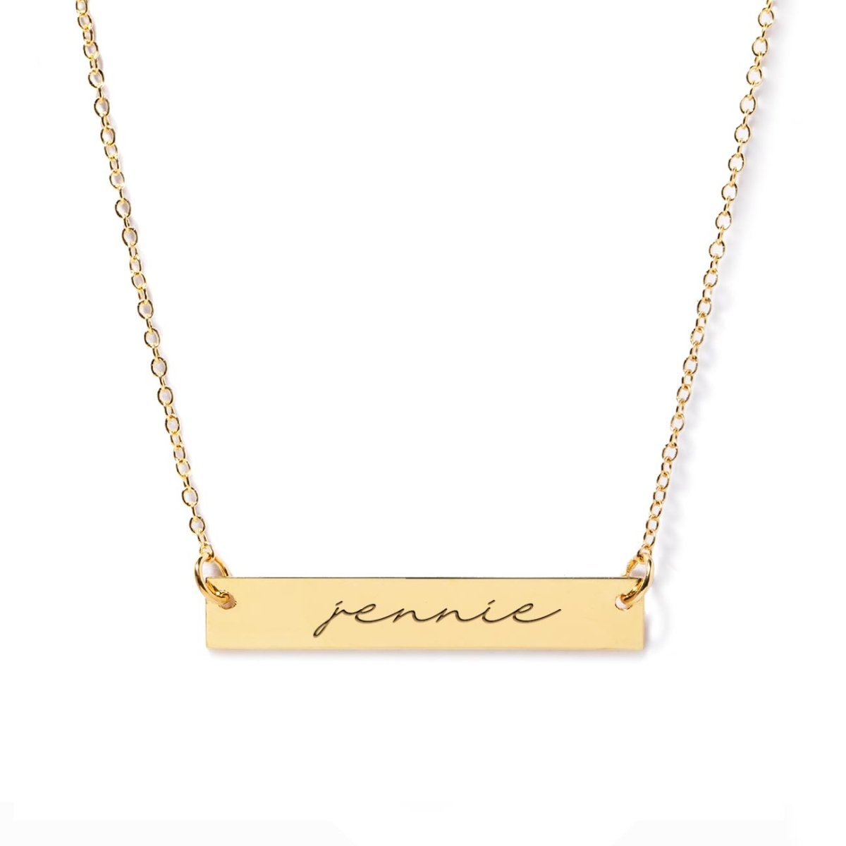 Gold vermeil name bar necklace engraved with a name, on a white background