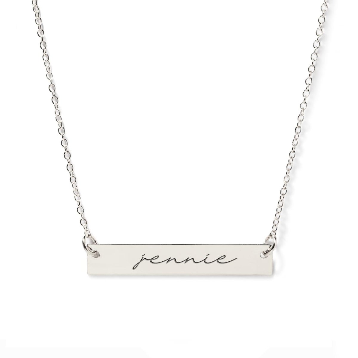 Sterling silver name bar necklace engraved with a name, on a white background