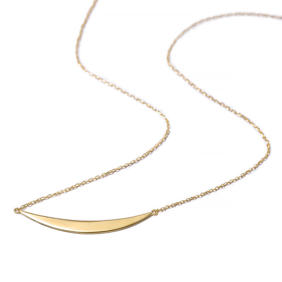 Gold vermeil crescent bar necklace with a curved polished bar on a fine chain, on a white background
