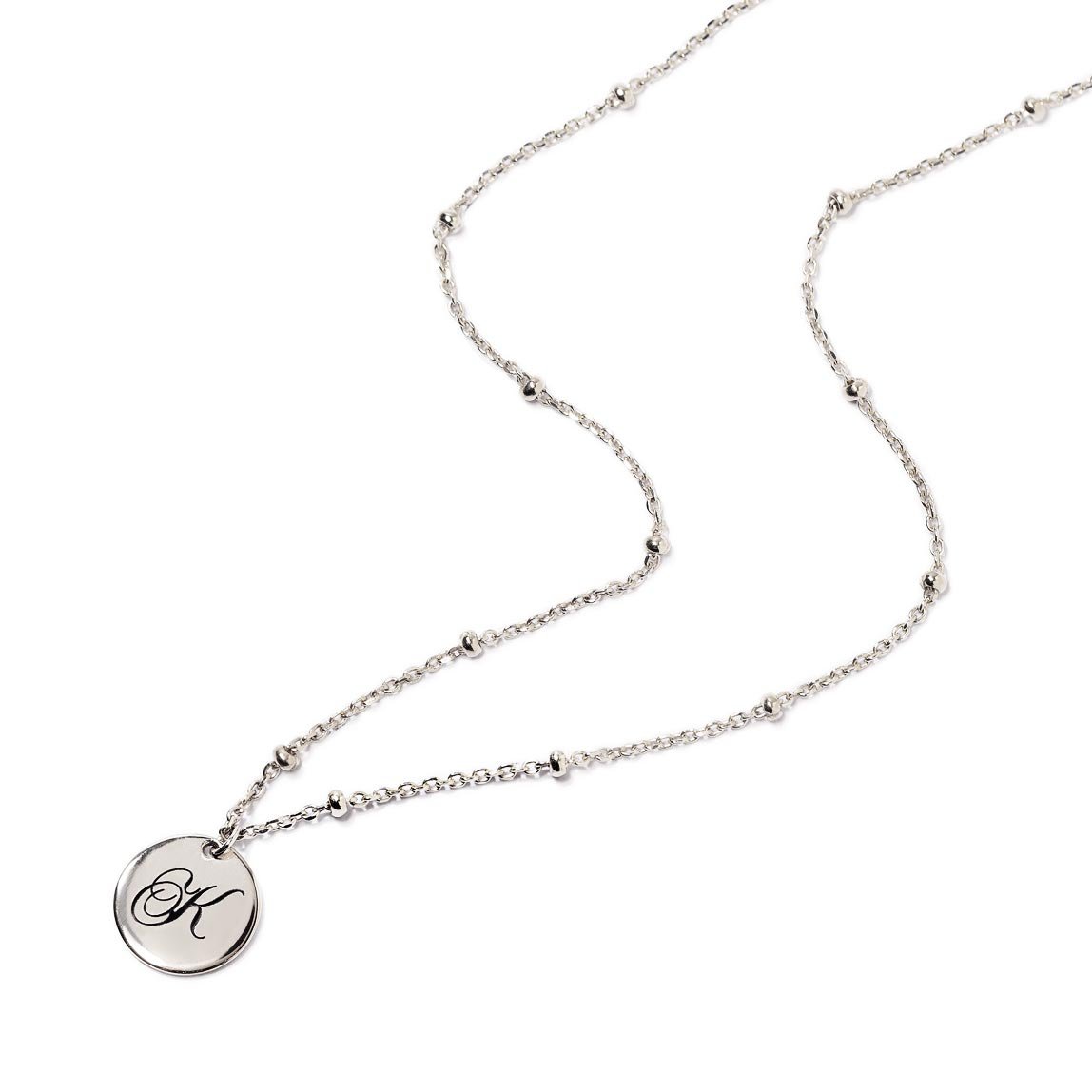 Sterling silver initial disc on a beaded chain necklace, engraved with an initial, on a white background