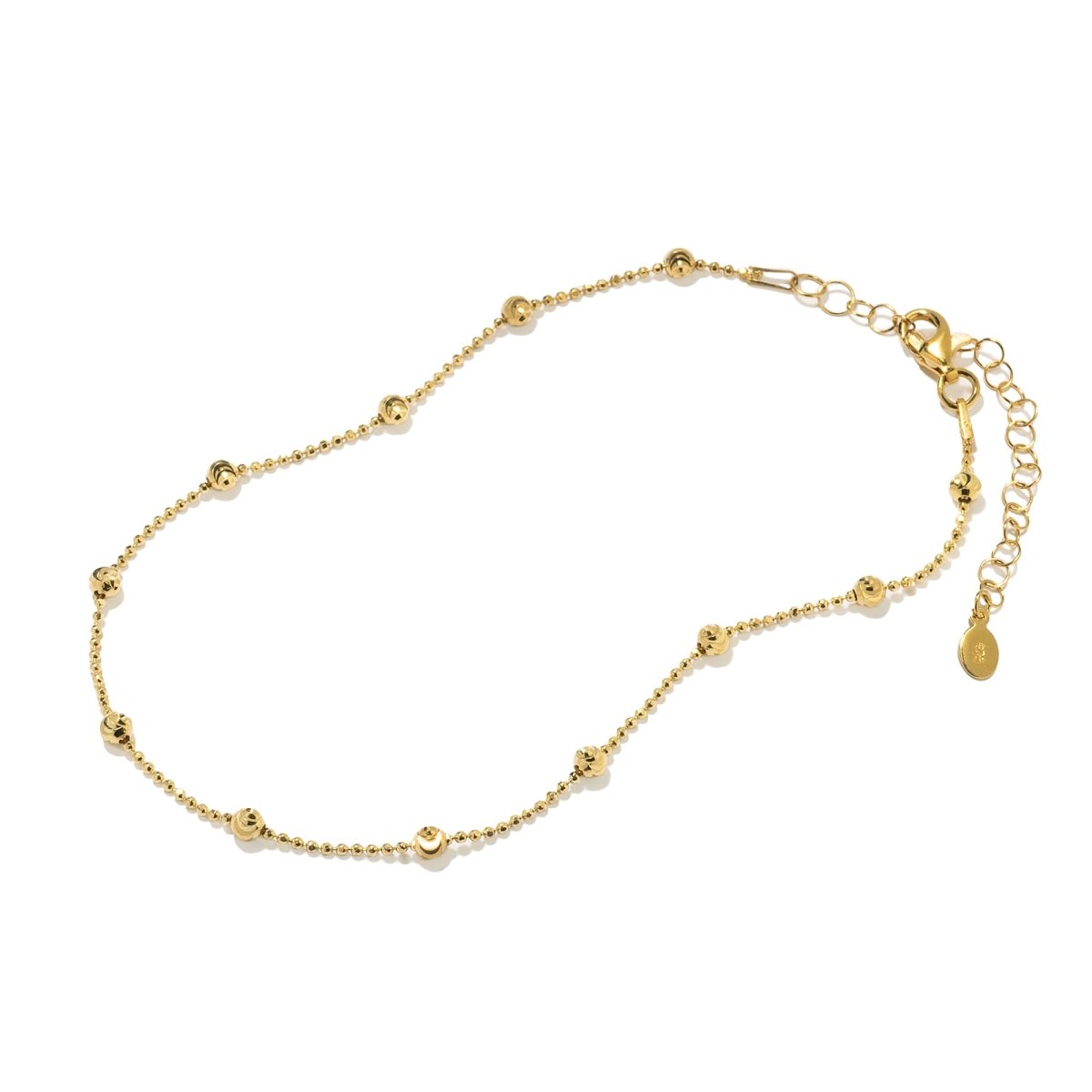 Gold vermeil faceted beaded chain anklet with an extender and lobster clasp, on a white background