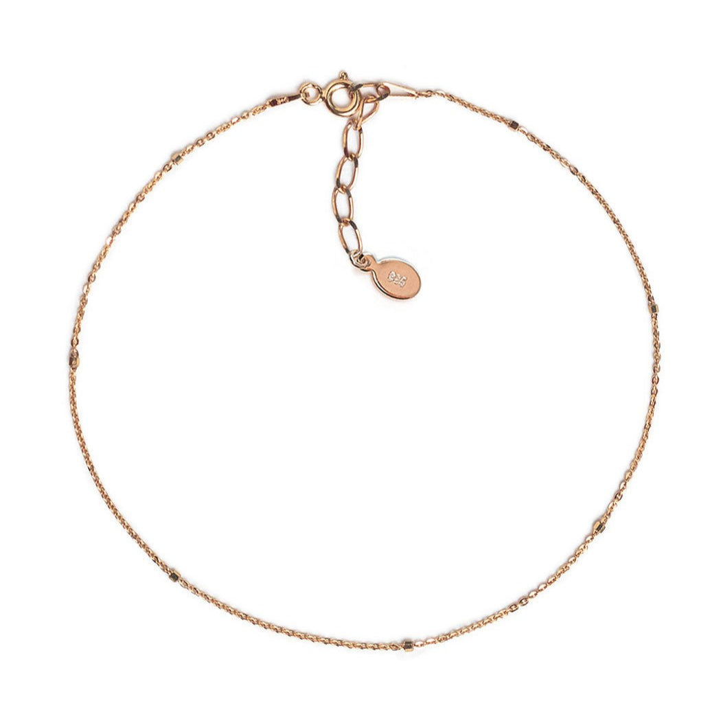 Rose gold vermeil dainty beaded anklet chain with a spring-ring clasp, on a white background