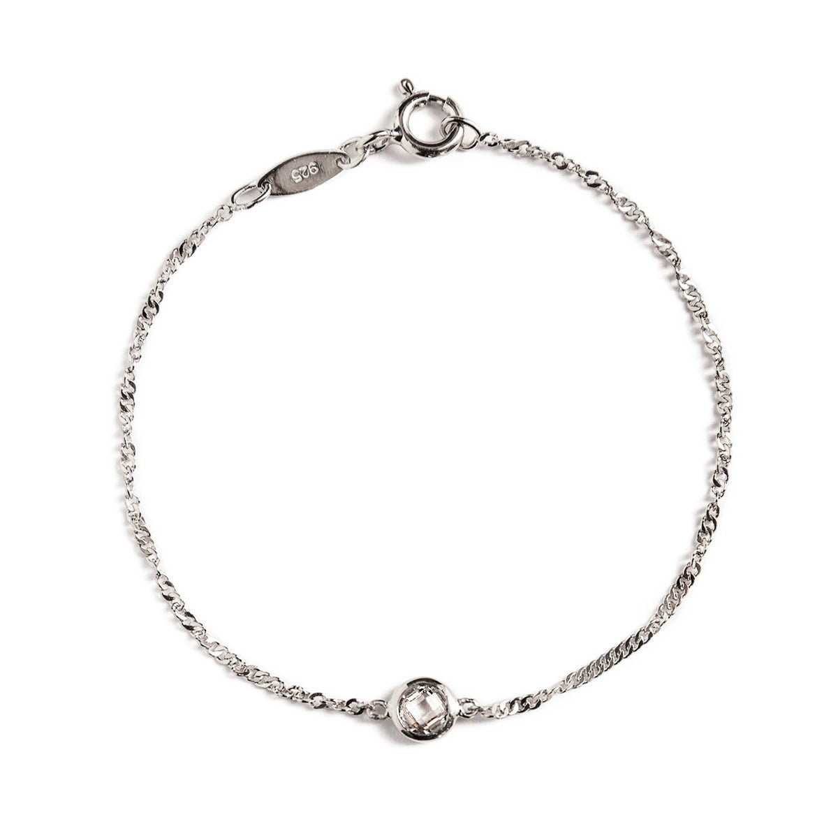 Sterling silver Singapore chain bracelet with a round clear bezel stone, on a white background