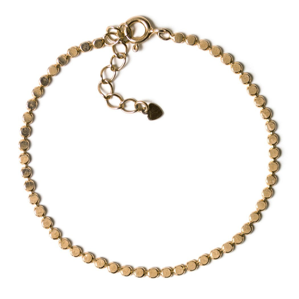 Gold vermeil beaded chain bracelet with a spring-ring clasp and extender, on a white background