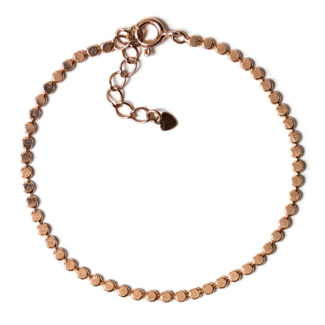 Rose gold vermeil beaded chain bracelet with a spring-ring clasp and extender, on a white background