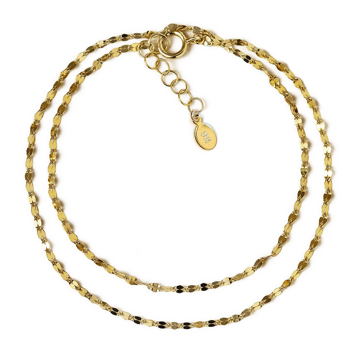 Gold vermeil layered bracelet set with a textured chain and adjustable extender, on a white background