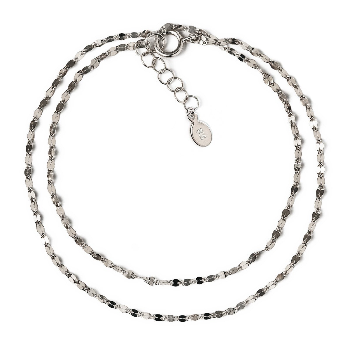 Sterling silver layered bracelet set with a textured chain and adjustable extender, on a white background
