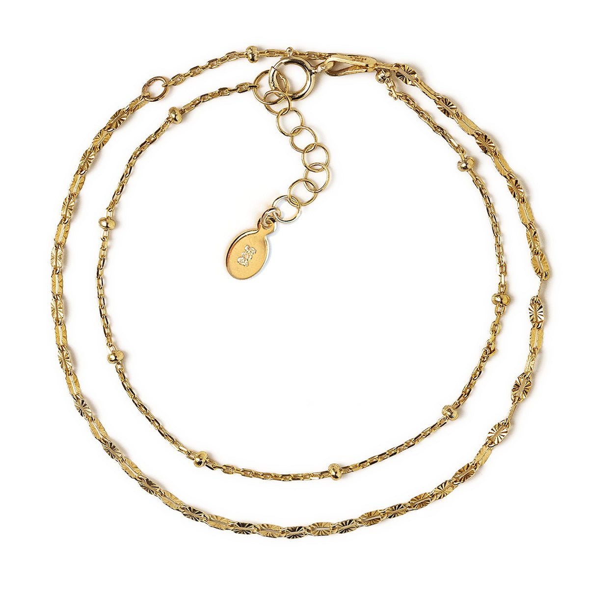 Gold vermeil double layered chain bracelet with a clasp and adjustable extender, on a white background