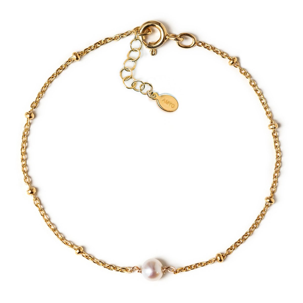 Gold vermeil beaded chain bracelet with a single pearl and a spring-ring clasp, on a white background