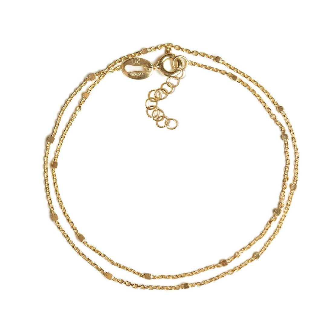 Gold vermeil layered beaded chain bracelet with an extender clasp, on a white background