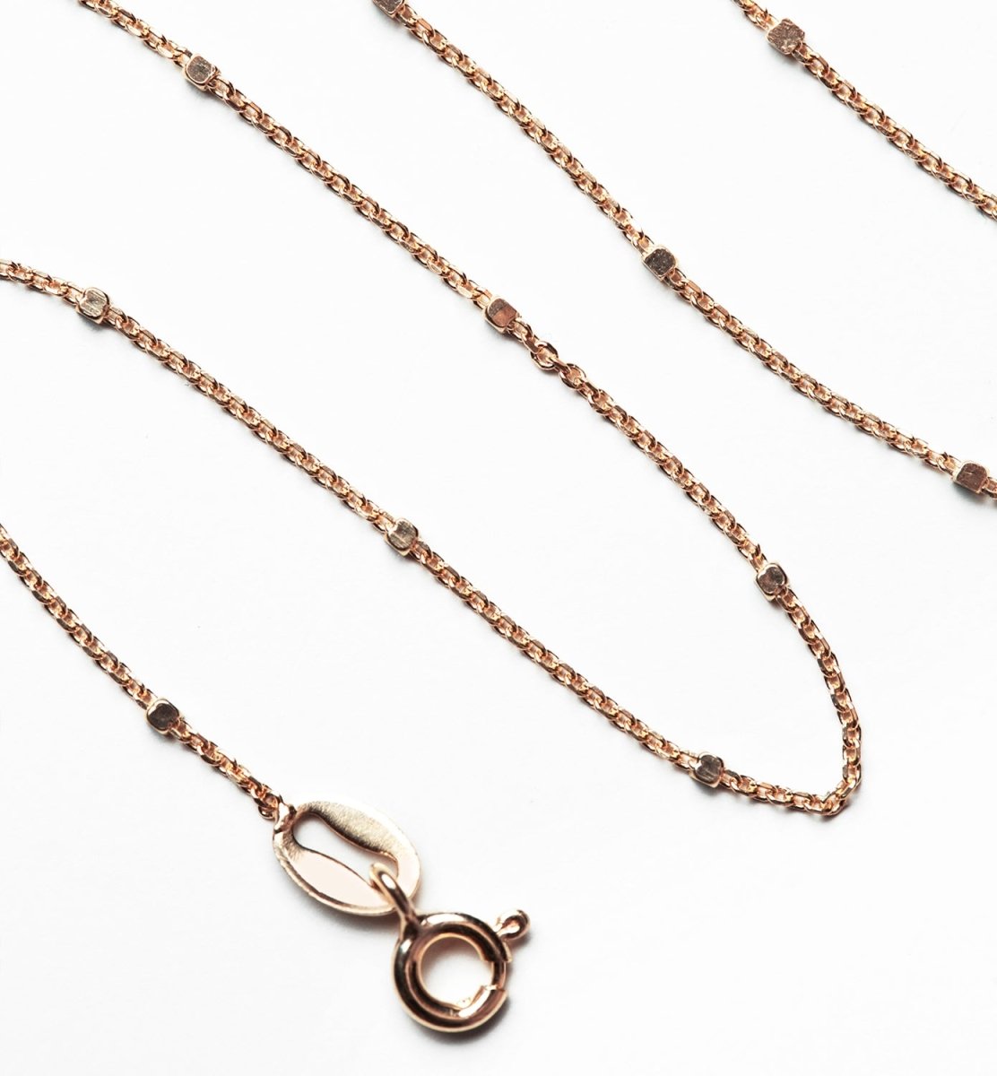 Rose gold vermeil dainty beaded anklet chain, close-up detail of the links and spring-ring clasp