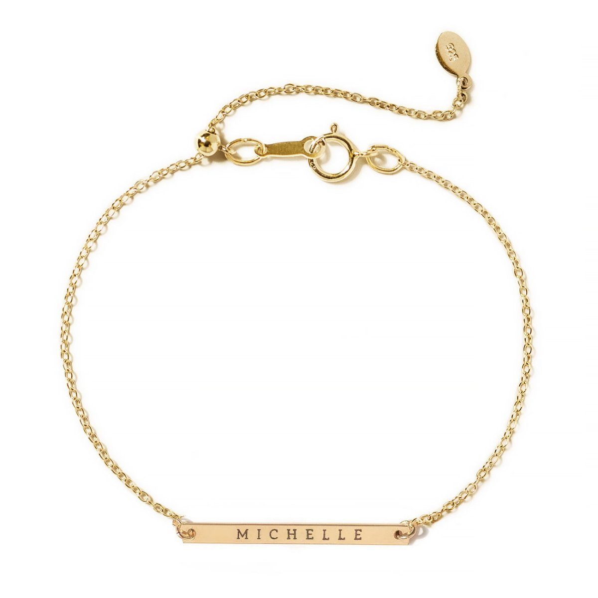 Gold-filled thin bar ID bracelet engraved with a name on an adjustable chain, on a white background