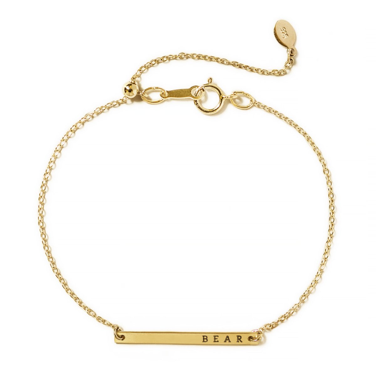 Gold-filled thin bar bracelet with a delicate chain and spring-ring clasp, engraved with a name, on a white background