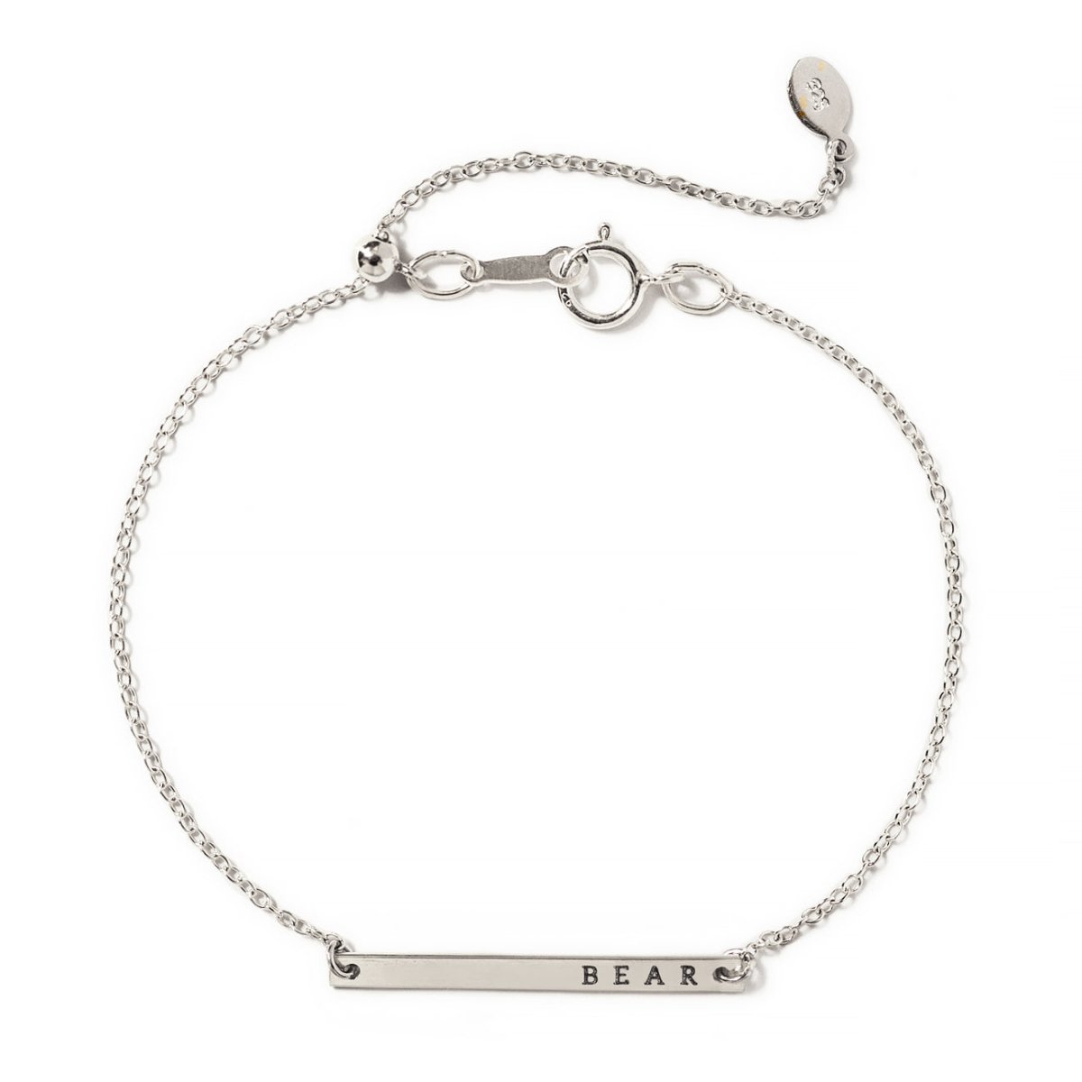 Sterling silver thin bar ID bracelet engraved with a name on an adjustable chain, on a white background