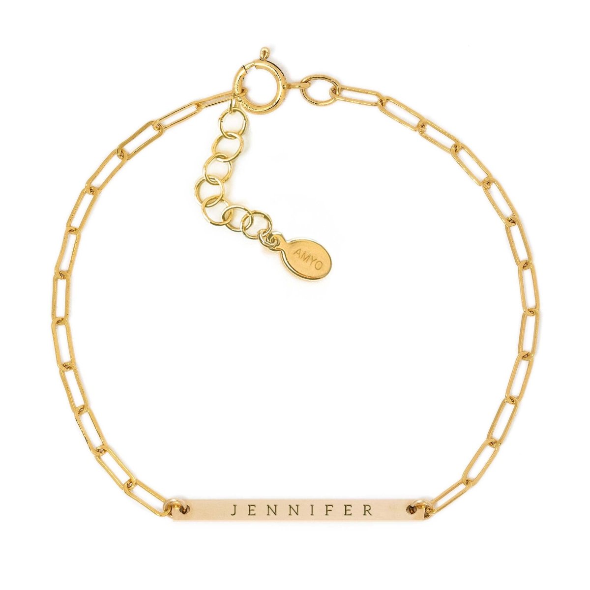 Gold-filled thin bar paperclip chain bracelet engraved with a name, on a white background