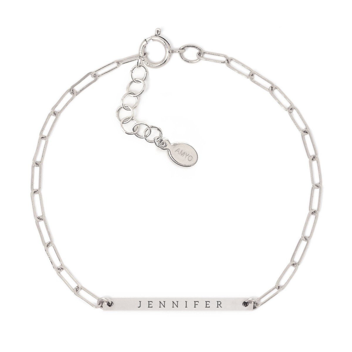 Sterling silver thin bar paperclip chain bracelet engraved with a name, on a white background