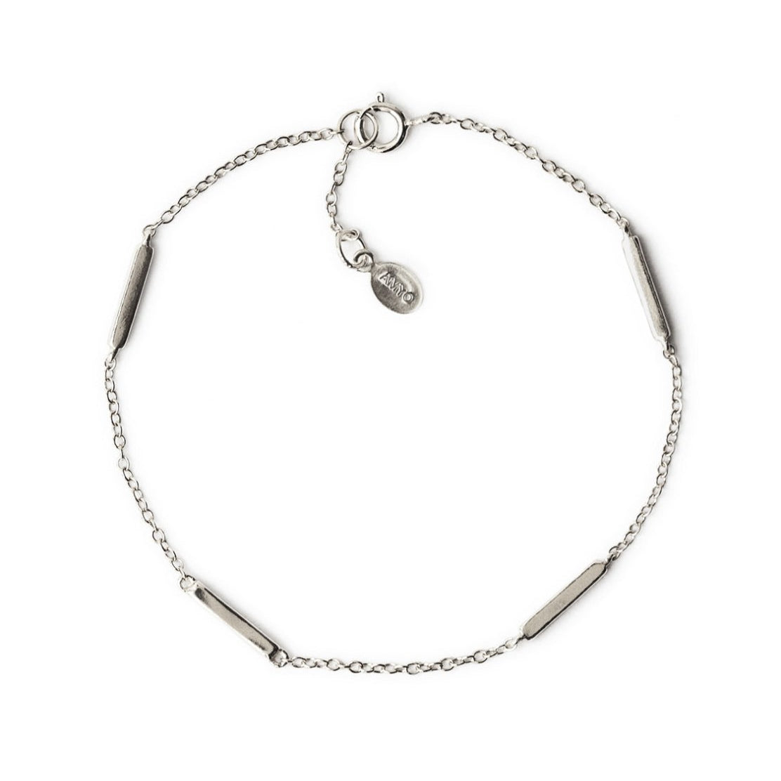 Sterling silver bar station bracelet with a spring-ring clasp, laid flat on a white background