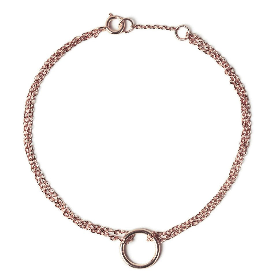 Rose gold vermeil eternity circle bracelet with a double chain and open circle, on a white background