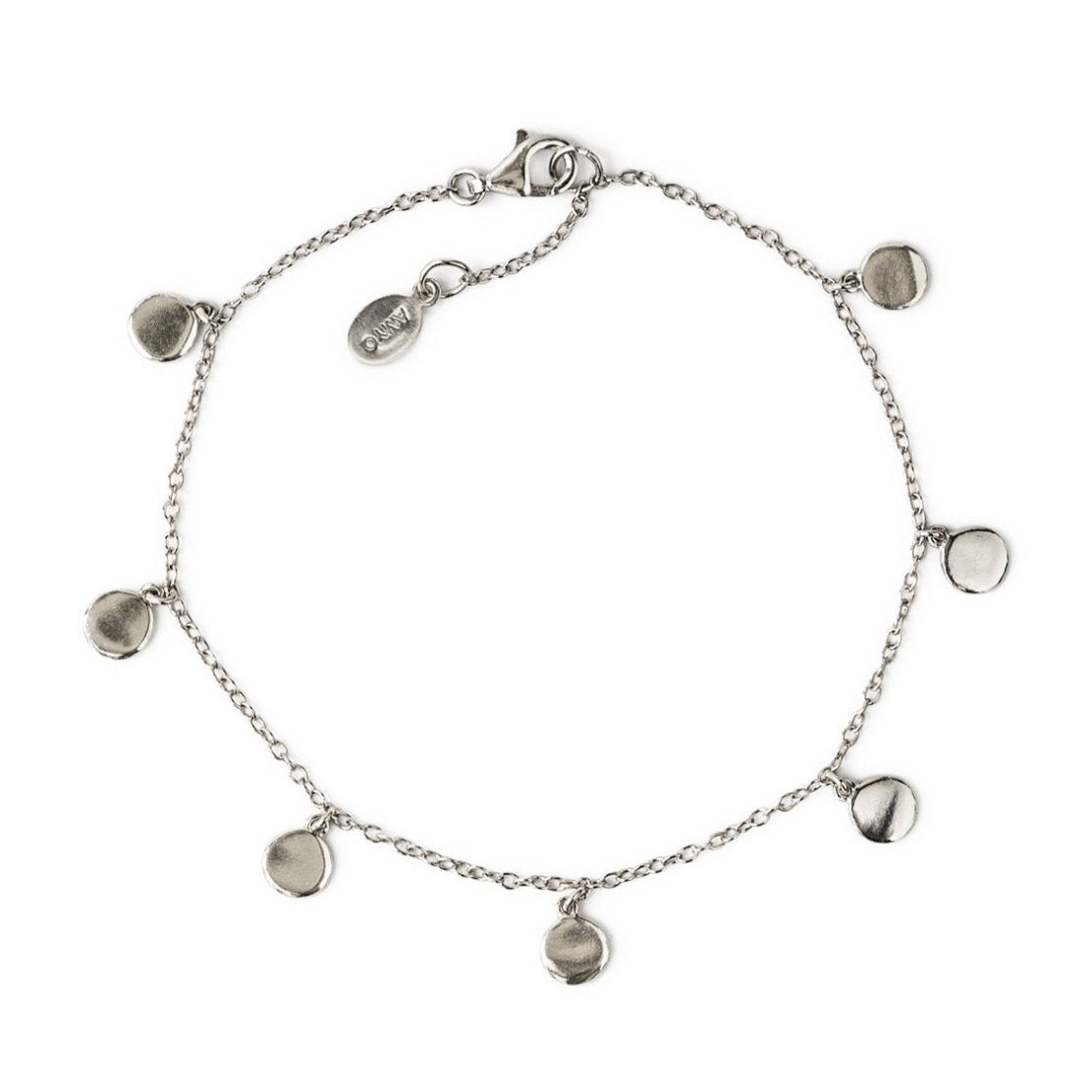 Sterling silver bracelet with seven round disc charms on a fine chain, on a white background